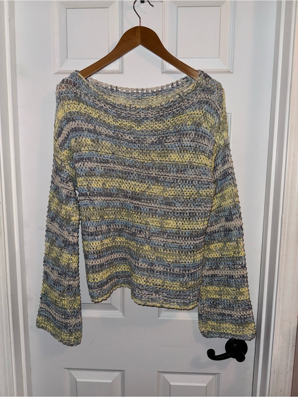 Multicolored open-knit striped sweater featuring re
